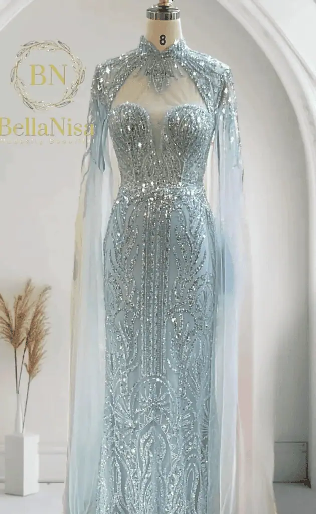 white mother of the bride dress displayed on a mannequin at a wedding venue, showcasing elegant design for the special day.